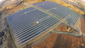 What are some benefits of a centralized approach in small utility solar projects?